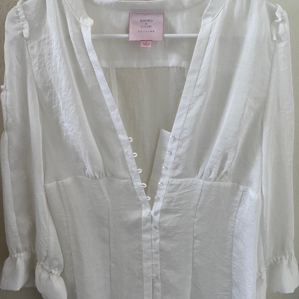 A white blouse from Romeo/Juliette Couture
